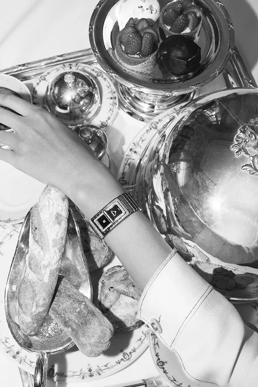 Steel case and bracelet. Steel bezel set with 52 brilliant-cut diamonds. Black lacquered dials, one set with a princess-cut diamond. High precision quartz movement. Water resistance: 30 meters. Dimensions: 38.1 x 21.5 mm. Diamonds: ~0.63 ct. Steel case and bracelet. Steel bezel set with 52 brilliant-cut diamonds. Black lacquered dials, one set with a princess-cut diamond. High precision quartz movement. Water resistance: 30 meters. Dimensions: 38.1 x 21.5 mm. Diamonds: ~0.63 ct.